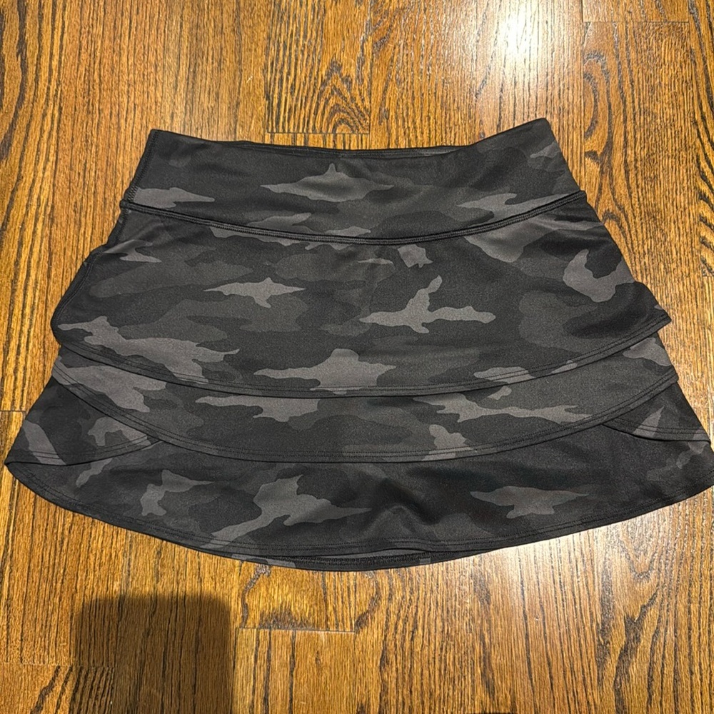 Black camouflage athleta girls tennis skirt with shorts built in